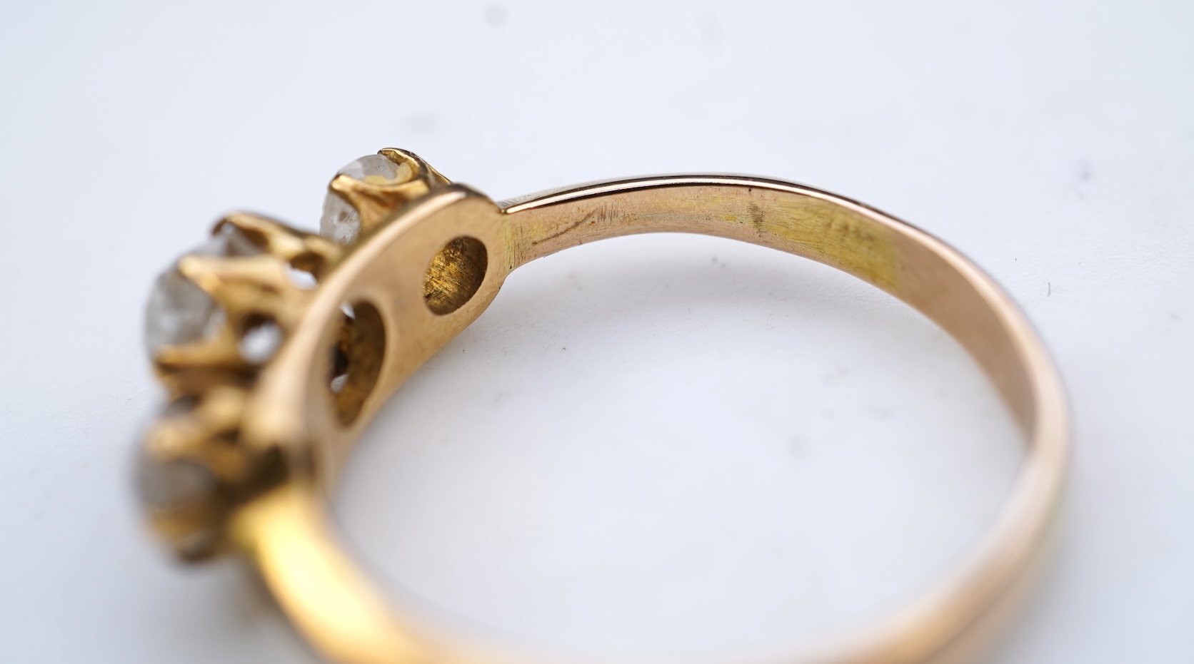 A three-stone diamond ring, early 20th century